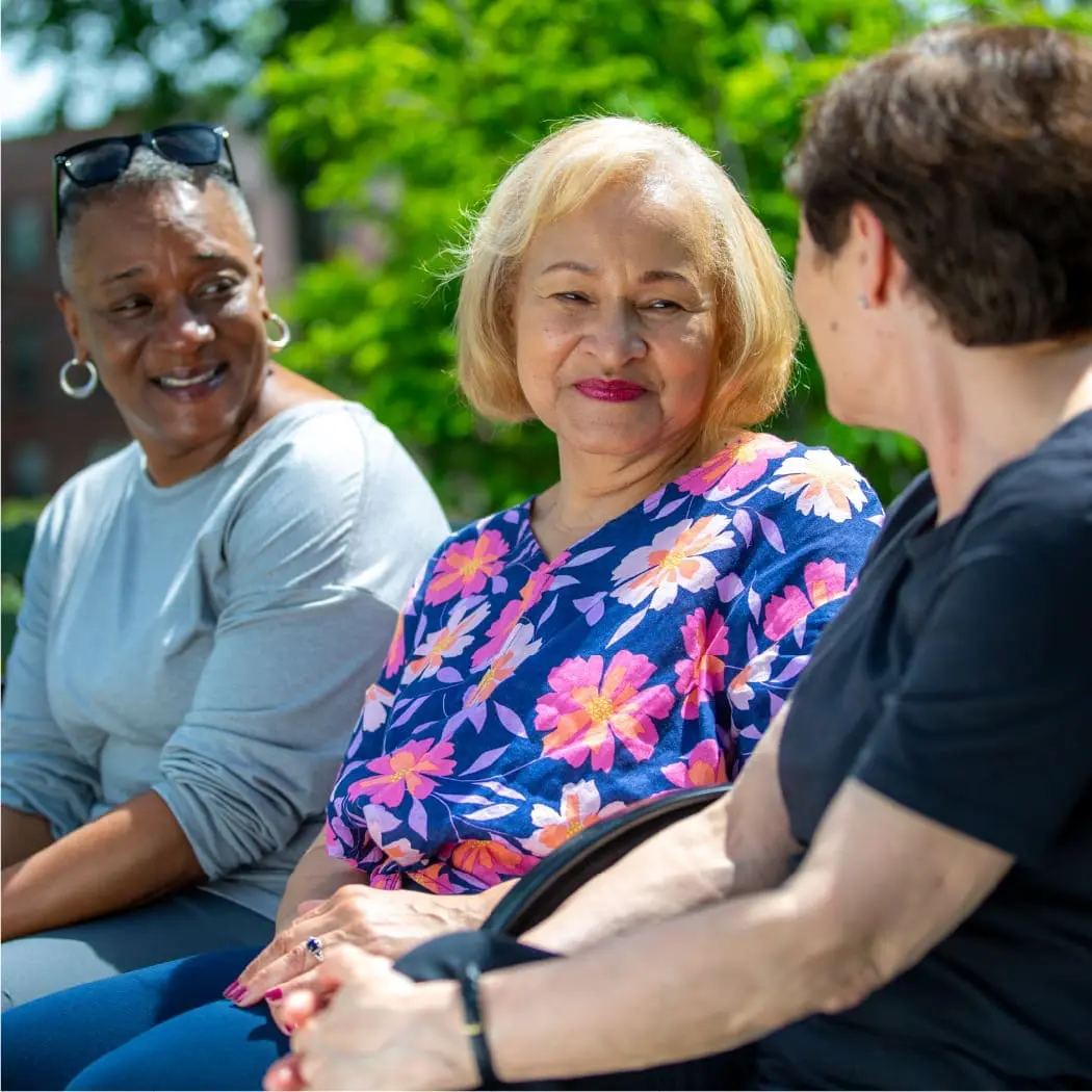 An elderly woman with her friends