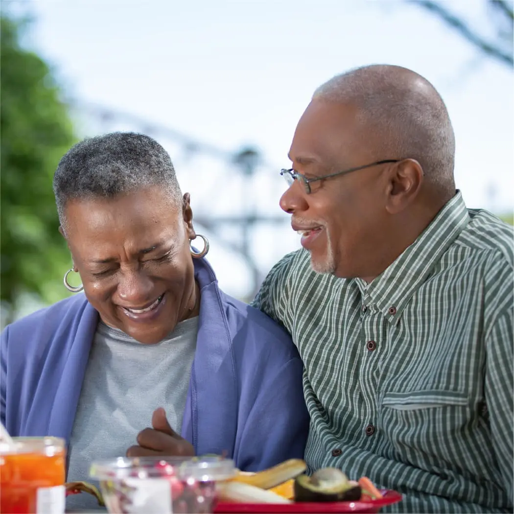 older couple enjoying a picnic together