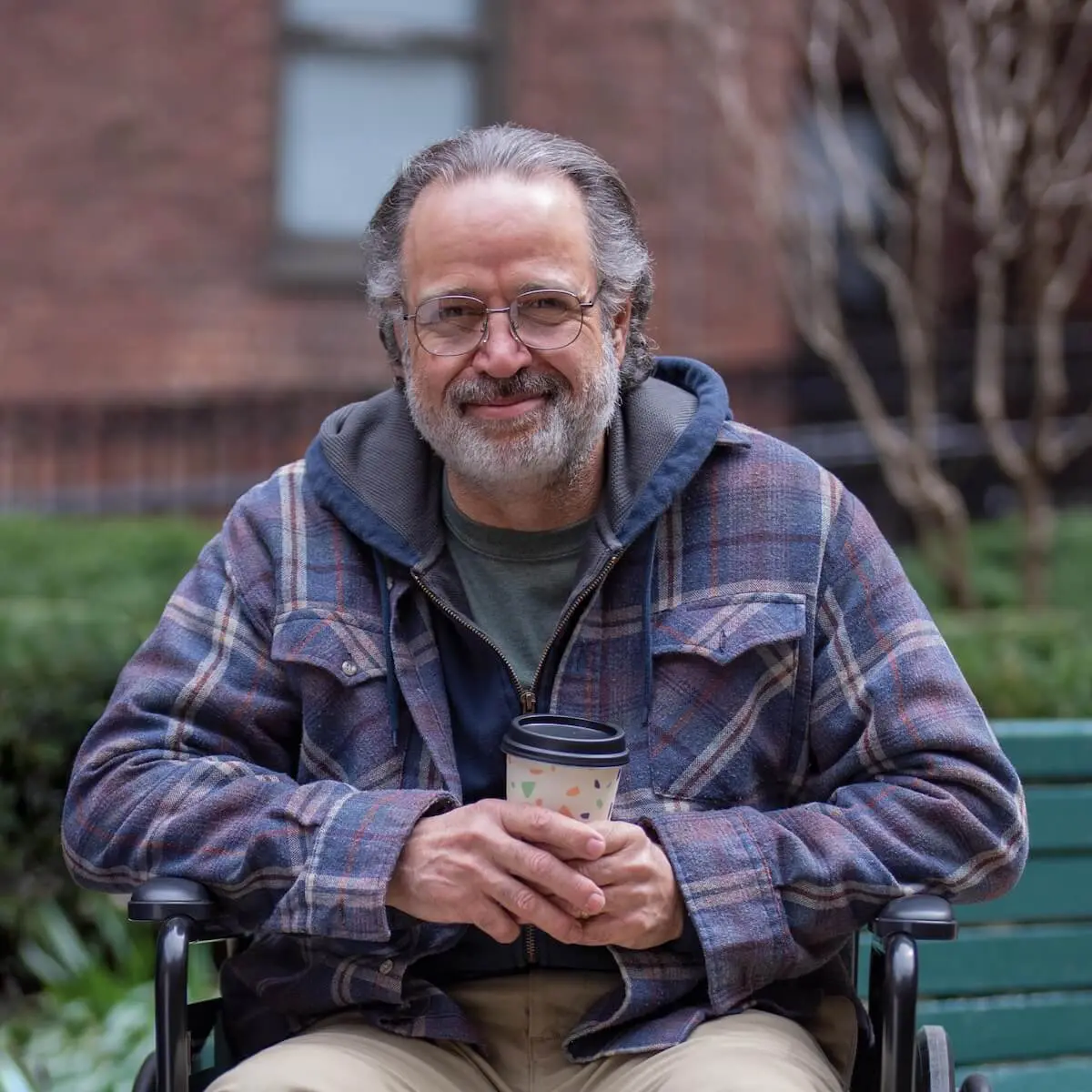 Older man sitting outside
