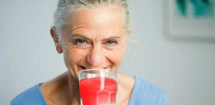 Woman drinking cranberry juice